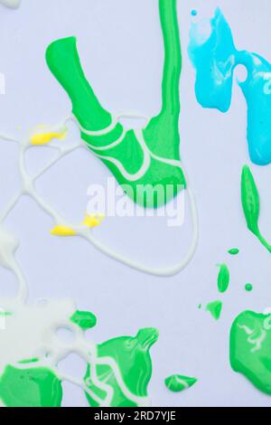 Abstract stains and streaks of green and blue paint. Stock Photo