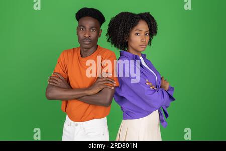 Confident, strict, serious, sad african american millennial couple with crossed arms on chest Stock Photo