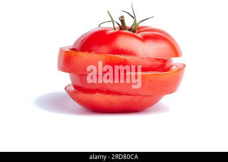 Fresh juicy sliced tomato on white background high contrast Stock Photo
