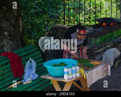 Stepanakert, Azerbaijan. 14th June, 2019. A lady seen preparing food outside Dadivank, an Armenian Apostolic monastery, in Kalbajar, Nagorno-Karabakh. The unrecognised yet de facto independent country in South Caucasus, Nagorno-Karabakh (also known as Artsakh) has been in the longest-running territorial dispute between Azerbaijan and Armenia in post-Soviet Eurasia since the collapse of Soviet Union. It is mainly populated by ethnic Armenians. (Photo by Jasmine Leung/SOPA Images/Sipa USA) Credit: Sipa USA/Alamy Live News Stock Photo