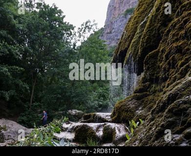 Stepanakert, Azerbaijan. 13th June, 2019. A local seen at the ''Umbrella Waterfall'' in Honut Canyon Natural Reserve of Shusha, Nagorno-Karabakh. The unrecognised yet de facto independent country in South Caucasus, Nagorno-Karabakh (also known as Artsakh) has been in the longest-running territorial dispute between Azerbaijan and Armenia in post-Soviet Eurasia since the collapse of Soviet Union. It is mainly populated by ethnic Armenians. (Credit Image: © Jasmine Leung/SOPA Images via ZUMA Press Wire) EDITORIAL USAGE ONLY! Not for Commercial USAGE! Stock Photo