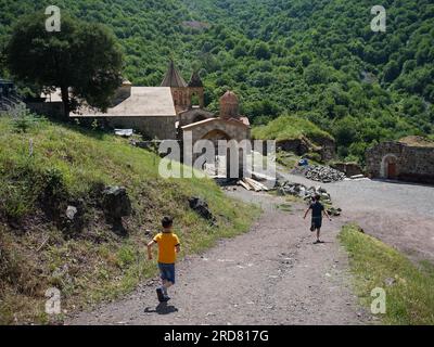Stepanakert, Azerbaijan. 14th June, 2019. Children seen running outside the Dadivank, an Armenian Apostolic monastery, in Kalbajar, Nagorno-Karabakh. The unrecognised yet de facto independent country in South Caucasus, Nagorno-Karabakh (also known as Artsakh) has been in the longest-running territorial dispute between Azerbaijan and Armenia in post-Soviet Eurasia since the collapse of Soviet Union. It is mainly populated by ethnic Armenians. (Photo by Jasmine Leung/SOPA Images/Sipa USA) Credit: Sipa USA/Alamy Live News Stock Photo