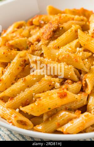 Homemade Tomato Pesto Pasta with Cheese and Basil Stock Photo