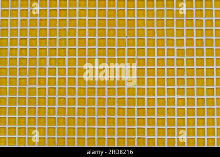 Background made of square small yellow mosaic with copy space Stock Photo