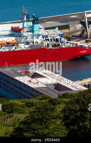 PORTLAND, ENGLAND – JUL 20  2023: Bibby Stockholm barge docked on land after arriving the day before. To house 500 UK asylum seekers. Portland, Weymou Stock Photo