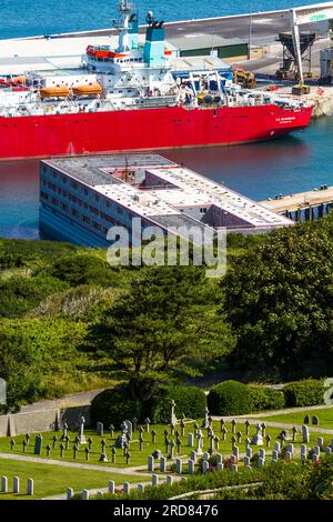 PORTLAND, ENGLAND – JUL 20  2023: Bibby Stockholm barge docked on land after arriving the day before. To house 500 UK asylum seekers, Portland Naval C Stock Photo