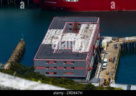 PORTLAND, ENGLAND – JUL 20  2023: Bibby Stockholm barge from above docked on land after arriving the day before. To house 500 UK asylum seekers. Portl Stock Photo