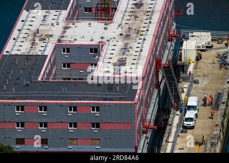 PORTLAND, ENGLAND – JUL 20  2023: Bibby Stockholm barge from above docked on land after arriving the day before. Being prepared to house 500 UK asylum Stock Photo