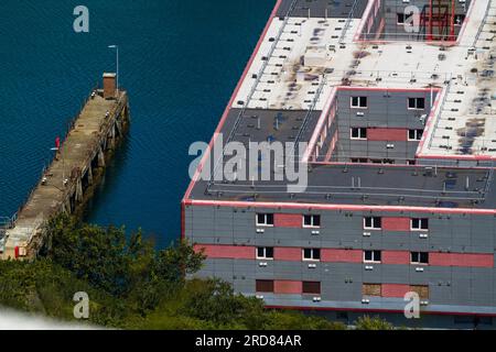 PORTLAND, ENGLAND – JUL 20  2023: Detail of Bibby Stockholm barge from above docked on land after arriving the day before. To house 500 UK asylum seek Stock Photo