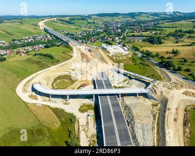 New fragment of highway under construction on Zakopianka road in Poland from Rdzawka to Nowy Targe over Klikuszowa, main place of traffic jams. State Stock Photo