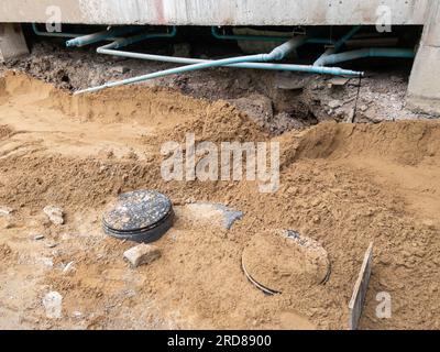The installation of a septic tank near a building under construction of the metro railway station, front view with the copy space. Stock Photo