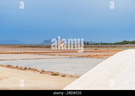 Windmill with pile of salt in the salt flats, Saline Ettore e Infersa, Marsala, province of Trapani, Sicily, Italy, Mediterranean, Europe Stock Photo