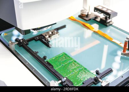 Printed wiring board during production process. Electronics manufacturing. Stock Photo