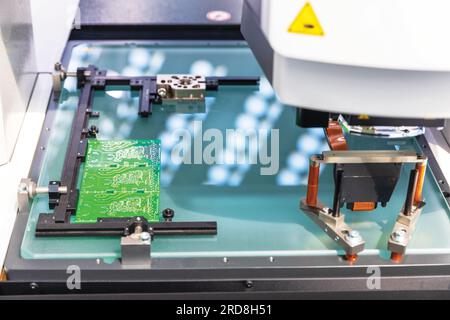 Printed circuit board during production process. Electronics manufacturing. Stock Photo