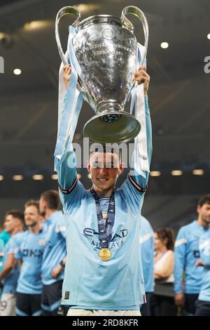 Manchester City's Phil Foden celebrates with the UEFA Champions League Trophy following victory over Inter Milan in the UEFA Champions League Final at the Ataturk Olympic Stadium, Istanbul. Picture date: Saturday June 10, 2023. See PA story SOCCER Final. Photo credit should read: Nick Potts/PA Wire. RESTRICTIONS: Use subject to restrictions. Editorial use only, no commercial use without prior consent from rights holder. Stock Photo