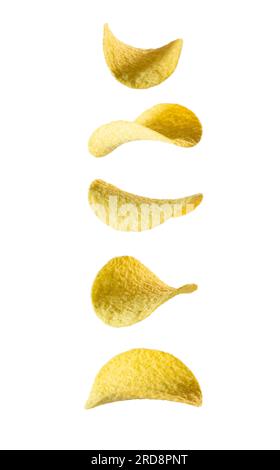 Potato chips levitate on a white background. Falling potato chips isolated on white background, flying potato crisps. Stock Photo