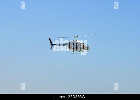 Helicopter in flight for sightseeing. Luxury lifestyle vacation. Tour on helicopter. Stock Photo