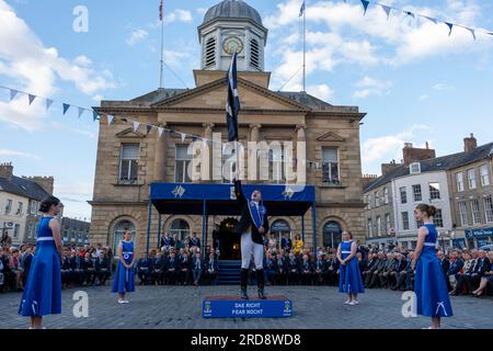 Kelso Civic Week Installation of the Kelso Laddie and Colour Bussing Ceremony The Square, Kelso. Wednesday 19 July 2023 Kelso Laddie: Andrew Thomson Ceremonial Convener: Ex-Laddie Murray Playfair & Master of Ceremonies: Dawn Hinnigan PROGRAMME ¥ 6.55 pm Announcement of Visiting Principals, Guests and Platform Party. ¥ 7.00 pm President and Hon. Provost Horsburgh & Mrs Horsburgh take their chairs and Ex-Laddies take up their positions. Kelso Laddie Andrew Thomson, accompanied by his Right-Hand Man, Callum Davidson and Left-Hand Man, Mark Henderson, along with the Standard Bearer, Ex-Kelso Laddi Stock Photo