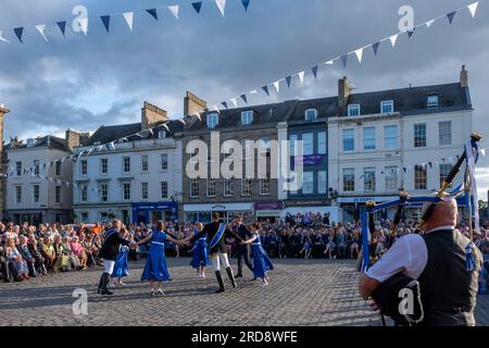 Kelso Civic Week Installation of the Kelso Laddie and Colour Bussing Ceremony The Square, Kelso. Wednesday 19 July 2023 Kelso Laddie: Andrew Thomson Ceremonial Convener: Ex-Laddie Murray Playfair & Master of Ceremonies: Dawn Hinnigan PROGRAMME ¥ 6.55 pm Announcement of Visiting Principals, Guests and Platform Party. ¥ 7.00 pm President and Hon. Provost Horsburgh & Mrs Horsburgh take their chairs and Ex-Laddies take up their positions. Kelso Laddie Andrew Thomson, accompanied by his Right-Hand Man, Callum Davidson and Left-Hand Man, Mark Henderson, along with the Standard Bearer, Ex-Kelso Laddi Stock Photo