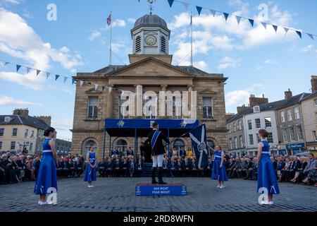 Kelso Civic Week Installation of the Kelso Laddie and Colour Bussing Ceremony The Square, Kelso. Wednesday 19 July 2023 Kelso Laddie: Andrew Thomson Ceremonial Convener: Ex-Laddie Murray Playfair & Master of Ceremonies: Dawn Hinnigan PROGRAMME ¥ 6.55 pm Announcement of Visiting Principals, Guests and Platform Party. ¥ 7.00 pm President and Hon. Provost Horsburgh & Mrs Horsburgh take their chairs and Ex-Laddies take up their positions. Kelso Laddie Andrew Thomson, accompanied by his Right-Hand Man, Callum Davidson and Left-Hand Man, Mark Henderson, along with the Standard Bearer, Ex-Kelso Laddi Stock Photo