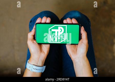 In this photo illustration, the New Jersey Turnpike Authority (NJTA) logo is seen displayed on a smartphone screen. Stock Photo