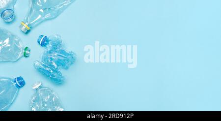 Empty bottle PET plastic recycling concept. Flat set crushed bottle crumpled plastic bottle recycling background trash plastic garbage PET recycling Stock Photo