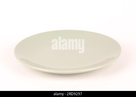 Empty gray green glass plate white background Stock Photo