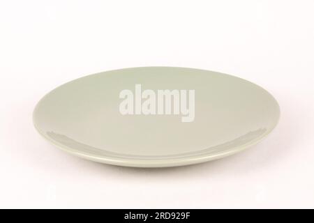 Empty gray green glass plate white background Stock Photo