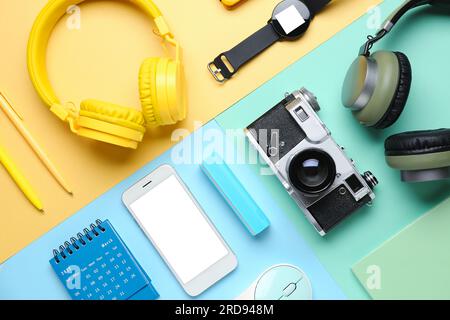 Composition with different gadgets and stationery on color background Stock Photo