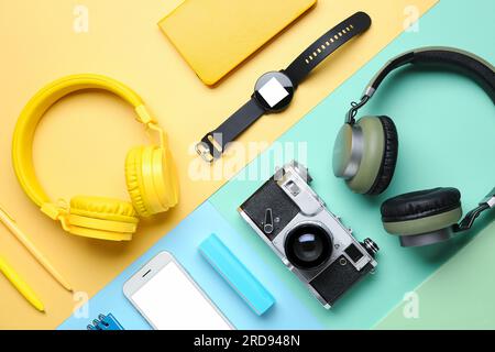 Composition with different gadgets and stationery on color background Stock Photo