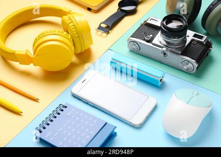 Composition with different gadgets and stationery on color background Stock Photo