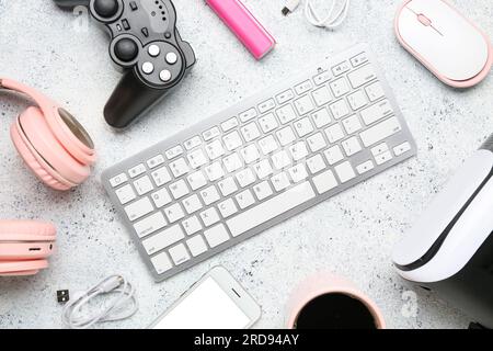 Composition with modern gadgets on light background Stock Photo