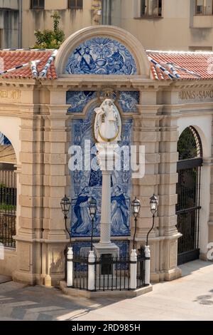 Image of the Virgen de los Remedios on a composite column, is located in Paseo Alcalde Sánchez Prados street, also called Gran via, in Ceuta, Spain. Stock Photo