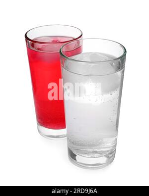 Glasses of different refreshing soda water with ice cubes on white background Stock Photo