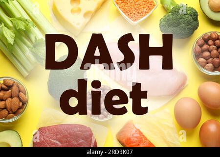 Dietary approaches to stop hypertension (Dash diet). Many different healthy food on yellow table, flat lay Stock Photo