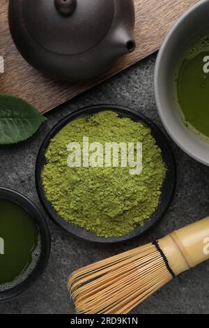 Flat lay composition with green matcha powder on grey table Stock Photo