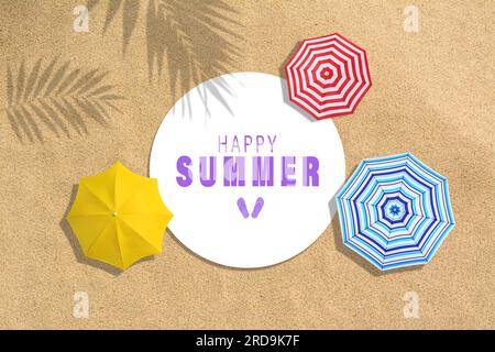 Phrase Happy summer, colorful beach umbrellas and shadows of leaves on sand, top view. Collage design Stock Photo