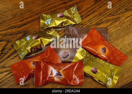 A variety of individually wrapped Godiva chocolates Stock Photo