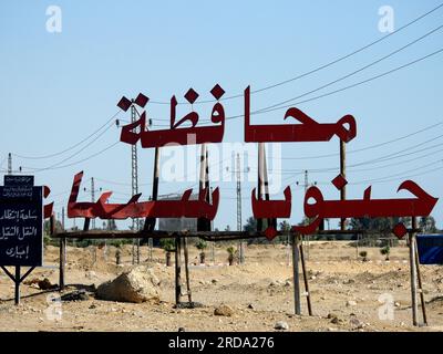 South Sinai, Egypt, June 30 2023: Translation of Arabic text (South Sinai Governorate City) near Ras Sedr city at Sharm El Sheikh international road, Stock Photo