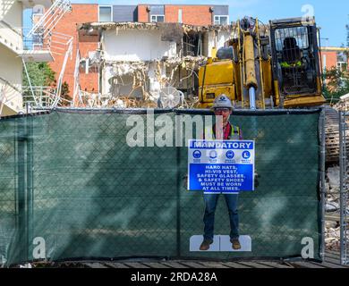 NEW ORLEANS, LA, USA - JULY 19, 2023: Cutout of construction worker with safety rules for workers at a demolition site on the Tulane University campus Stock Photo