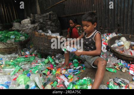 Dhaka, Dhaka, Bangladesh. 18th March, 2023. under-age worker or child labour still work in many plastic bottle recycling factorie.photo was taken kmar Stock Photo
