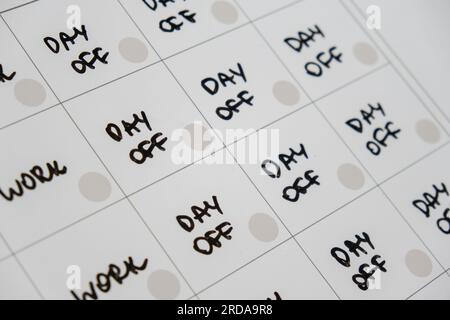 Magnetic board writing 4 day work week calendar with three weekend days off four day working week concept. Modern approach doing business short workweek. Effectiveness of employees. Productivity and efficiency days off  Stock Photo