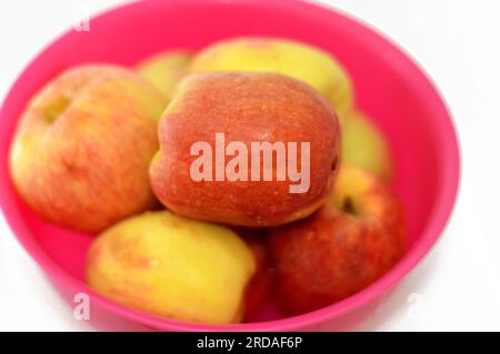 Bowl full of Egyptian fresh Apples, An apple is a round, edible fruit produced by an apple tree (Malus domestica). Apple trees are cultivated worldwid Stock Photo