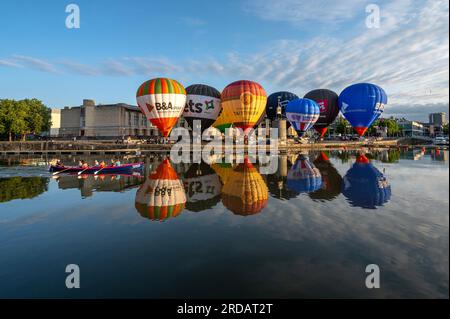 Hot air balloons take take to the sky above the Habourside in Bristol ahead of the Bristol International Balloon Fiesta next month. Stock Photo