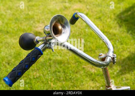 Vintage horn on handlebar of an old bicycle Stock Photo