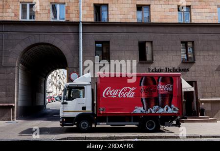 Minsk, Belarus, July 2023 -  Red Coca-Cola delivery truck parked in the street Stock Photo