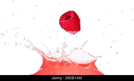 Ripe raspberry falling into pink liquid juice splash isolated on white background. Real shot. Stock Photo