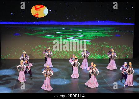 Jakarta, Indonesia. 19th July, 2023. Dancers from China's Xinjiang Art Theater Muqam Art Troupe perform in Taman Ismail Marzuki in Jakarta, Indonesia, July 19, 2023. Dozens of dancers and singers from China's Xinjiang Art Theater Muqam Art Troupe enlivened the stage of Taman Ismail Marzuki, the art center here in Indonesia's capital on Wednesday night.TO GO WITH 'Art troupe from China's Xinjiang enlivens Muslim festival in Indonesian cities' Credit: Xu Qin/Xinhua/Alamy Live News Stock Photo