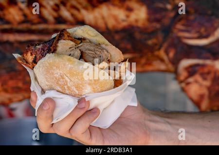 famous traditional portugal pork sandwich called bifana to take away . Stock Photo