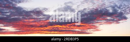 Widescreen panorama of the sky with clouds at sunset Stock Photo